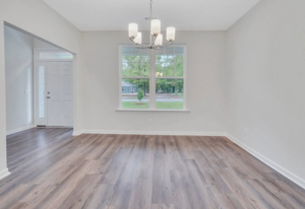 Breakfast area beside the kitchen with windows overlooking the back yard and LVP flooring